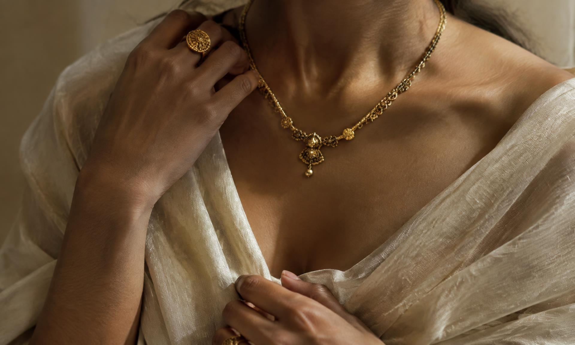 Gold necklace and ring worn with ivory raw silk